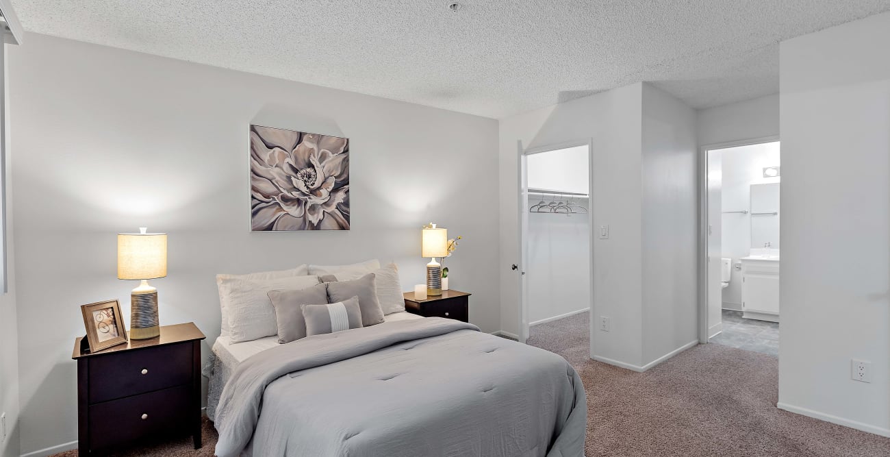 Spacious primary bedroom with a walk-in closet and a bathroom at The Ridgeview in Northridge, California