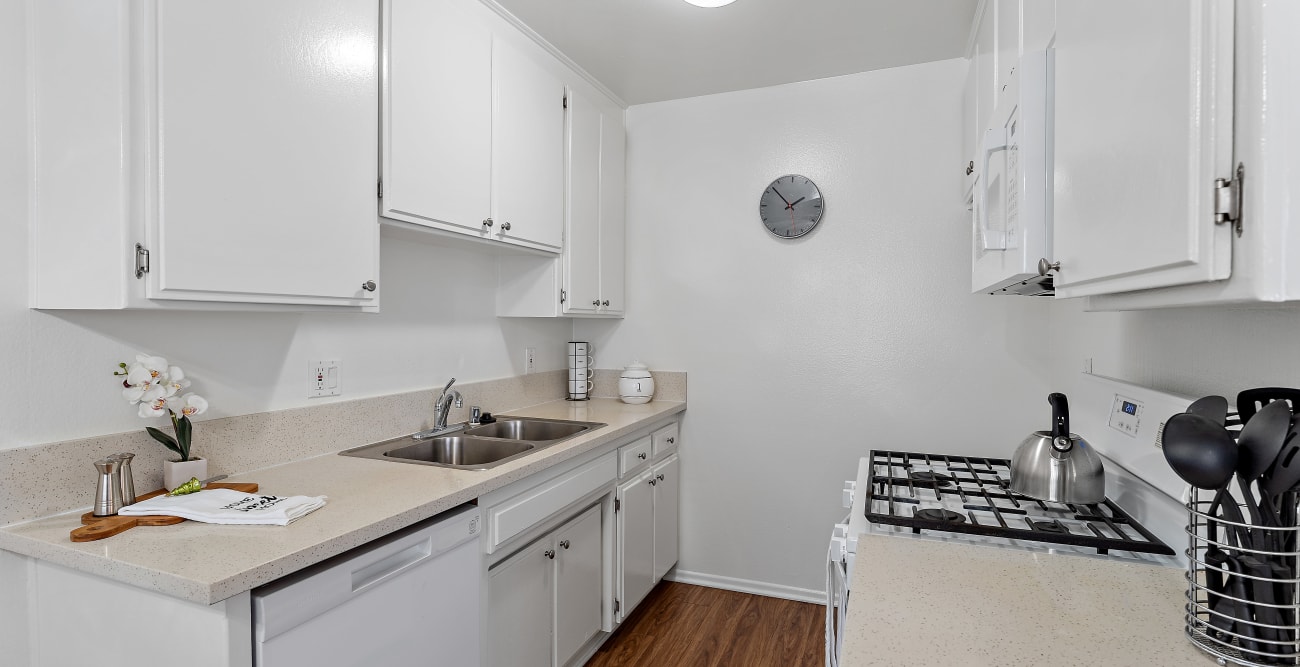 Kitchen with gas range, dishwasher, and microwave at The Ridgeview