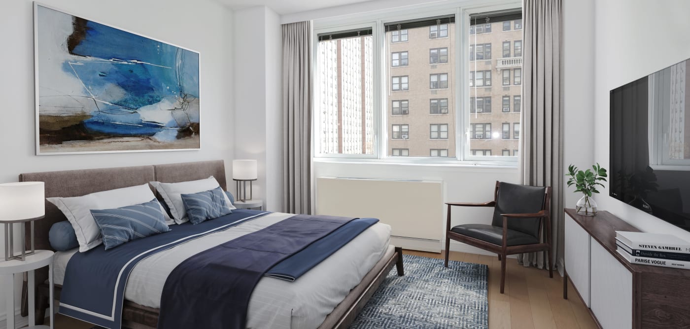 Huge windows with city views in the bedroom at The Melar in New York, New York
