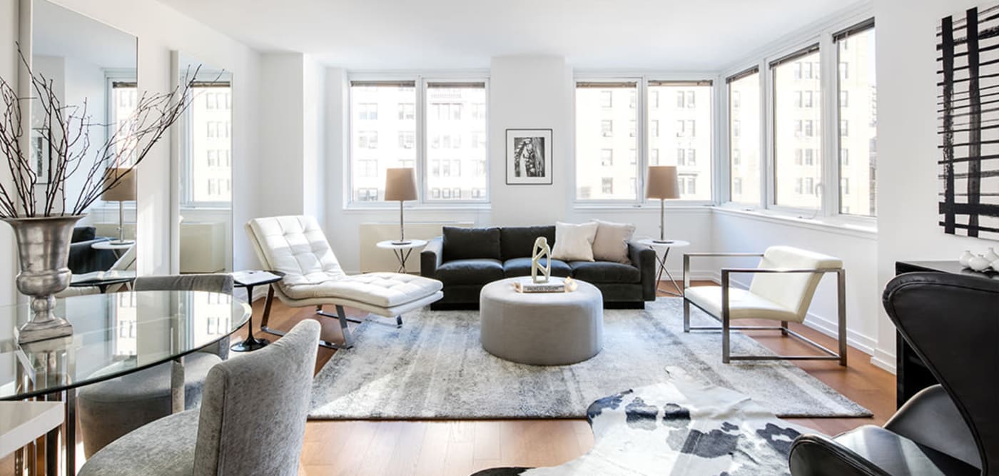Very open living room with tons of windows at The Melar in New York, New York