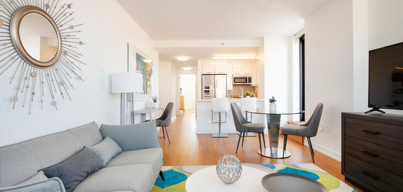 Bright model home living and kitchen area at The Melar in New York, New York