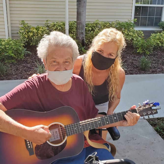 resident playing a guitar