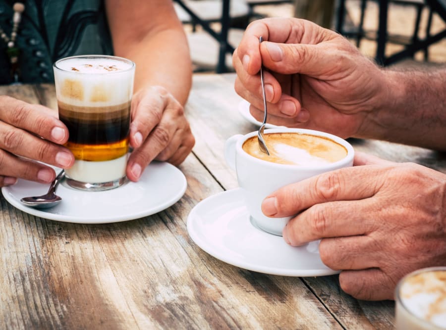 Seniors enjoying coffee at The Meridian at Waterways in Fort Lauderdale, Florida
