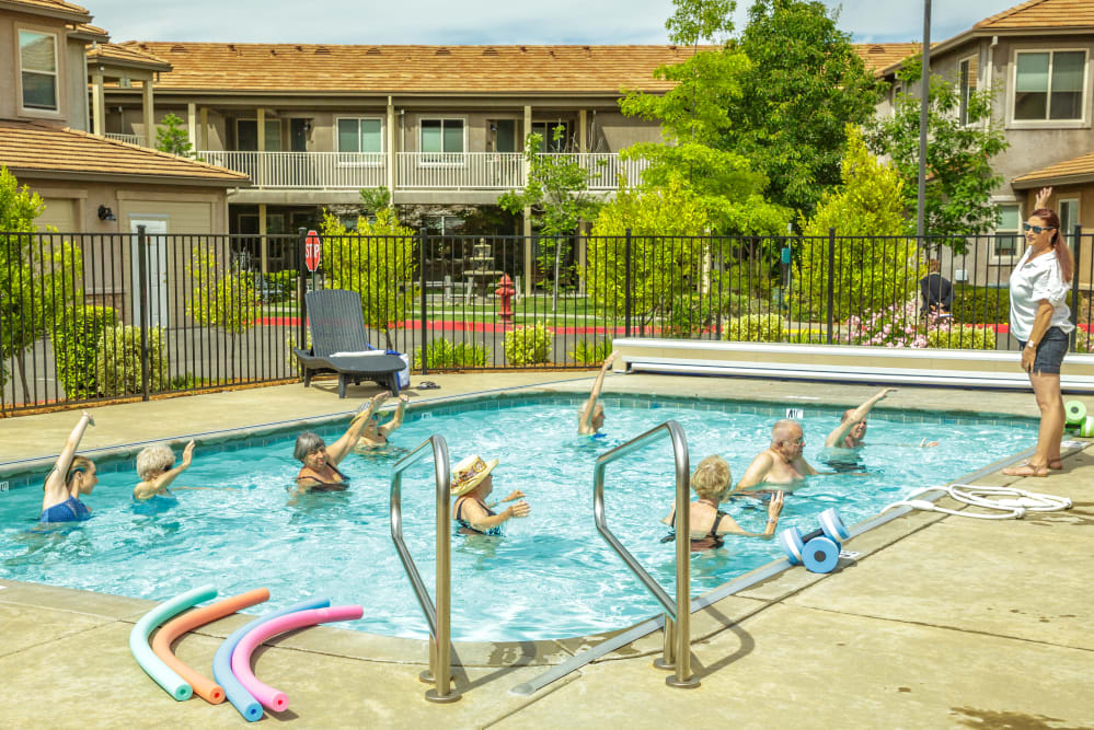 Residents exercising in pool at Ponté Palmero in Cameron Park, California