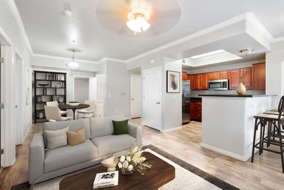Living and dining area with wooden flooring at Wolf Ranch Condominium Rentals in Sacramento, California