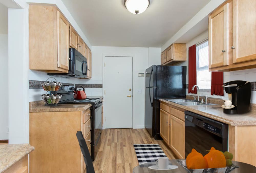 Kitchen with black appliance at Park Place Townhomes in Buffalo, New York