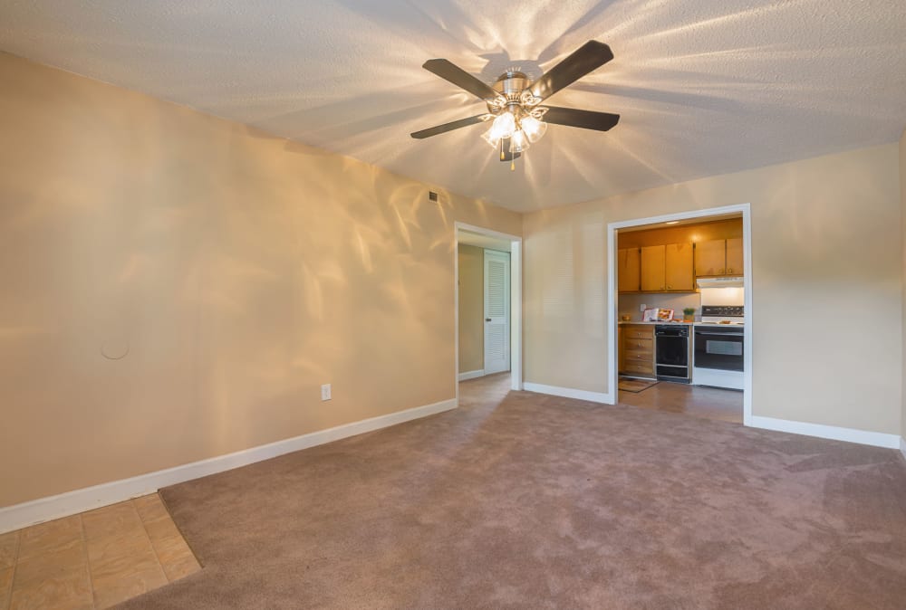 Living space with a ceiling fan at Lakewood Apartment Homes in Salisbury, North Carolina