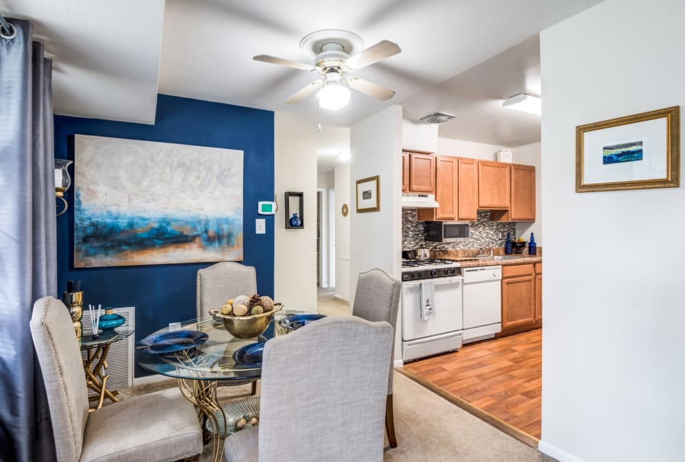 Dining area and kitchen of a model home at Willow Lake Apartment Homes in Laurel, Maryland