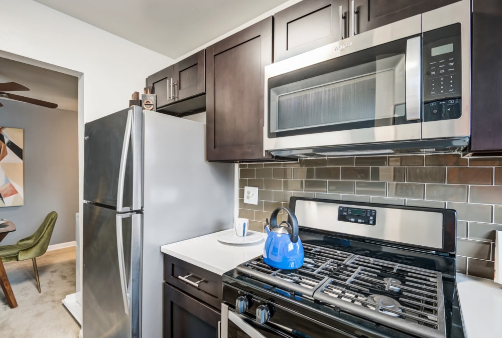 Modern kitchen with stainless-steel appliances at Lynbrook at Mark Center Apartment Homes in Alexandria, Virginia