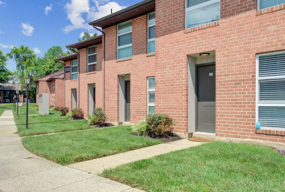 Townhomes with a brick exterior at Sherwood Village Apartment & Townhomes in Eastampton, New Jersey