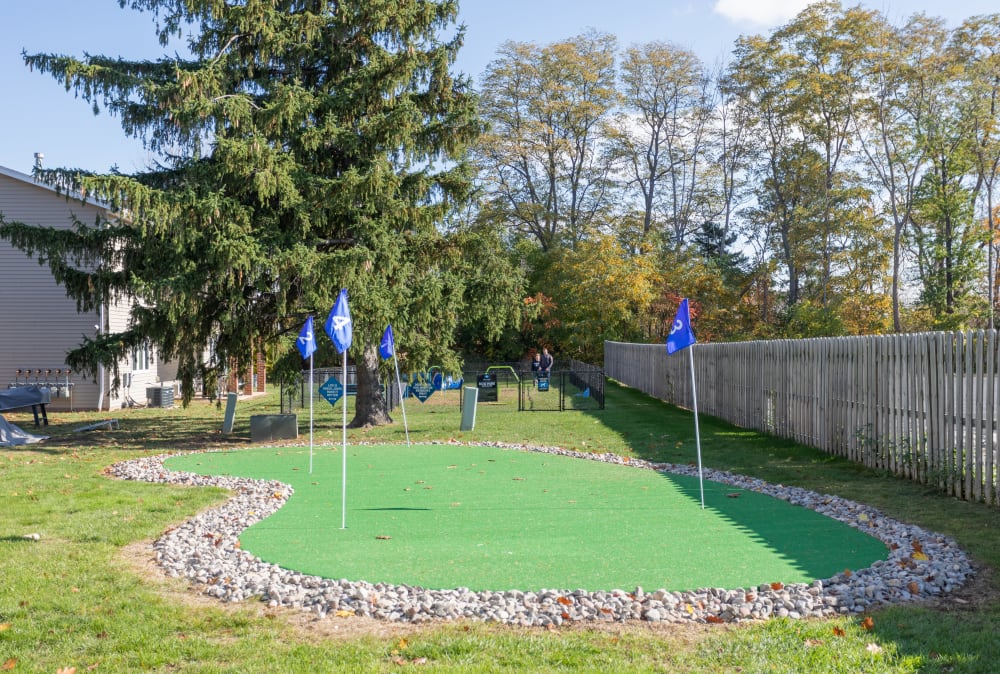 Golf putting green at Newcastle Apartments & Townhomes home in Rochester, New York