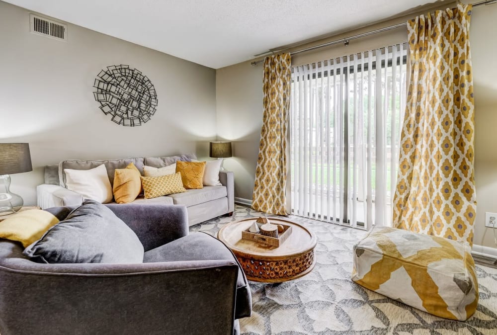 Living room with walk out access at Forestbrook Apartments & Townhomes in West Columbia, South Carolina