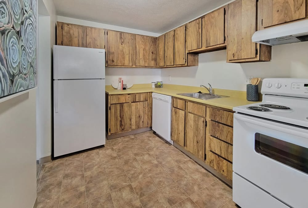 Beautiful modern kitchen with white appliances at Westpointe Apartments in Pittsburgh, Pennsylvania