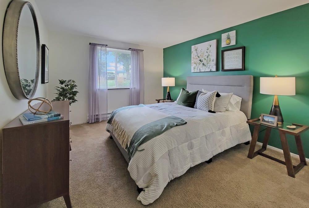 Luxurious and spacious bedroom with access to natural lighting at Westpointe Apartments in Pittsburgh, Pennsylvania