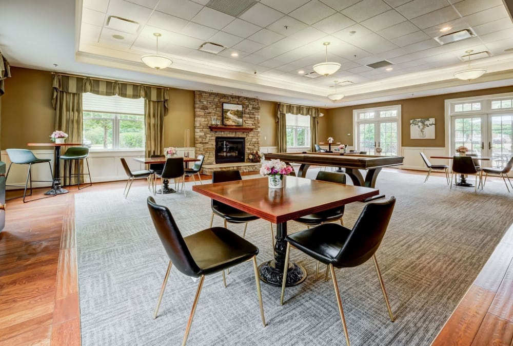 Clubhouse with dining area and pool table and gorgeous view located at Marquis Place in Murrysville, Pennsylvania