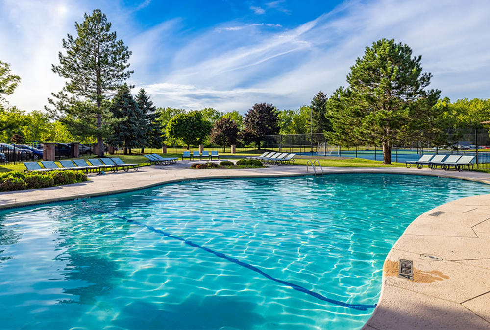 Swimming pool and outdoor lounge seating at Idylwood Resort Apartments in Cheektowaga, New York