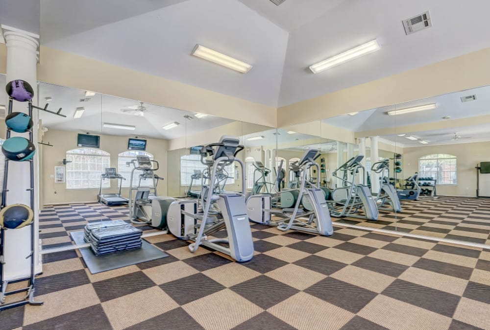 Fitness center workout equipment at Champion Lake Apartment Homes in Shreveport, Louisiana