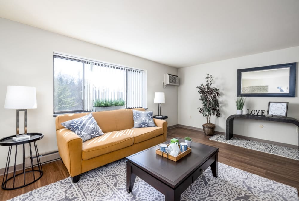 Spacious and modern living room fully furnished with kitchen access Maiden Bridge & Canongate Apartments in Pittsburgh, Pennsylvania