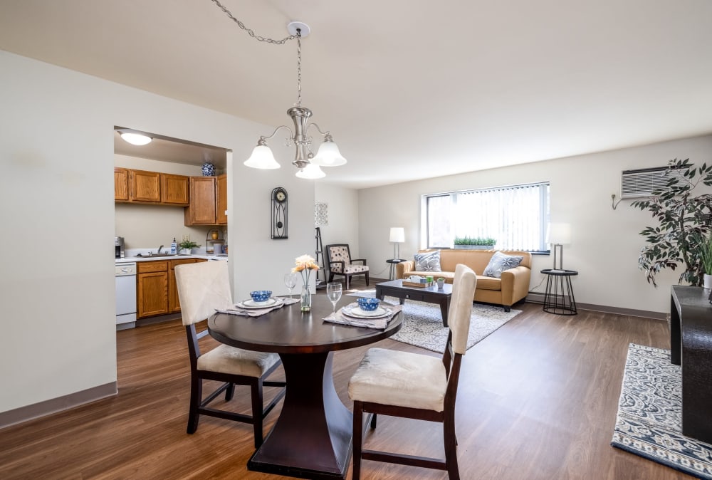 Well lit dining room with a gorgeous window view located at Maiden Bridge & Canongate Apartments in Pittsburgh, Pennsylvania