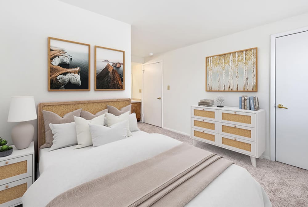 Model bedroom with wall to wall carpeting at Idylwood Resort Apartments in Cheektowaga, New York