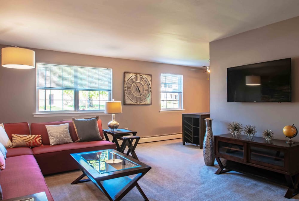 Interior living room with large windows at Camp Hill Plaza Apartment Homes in Camp Hill, Pennsylvania