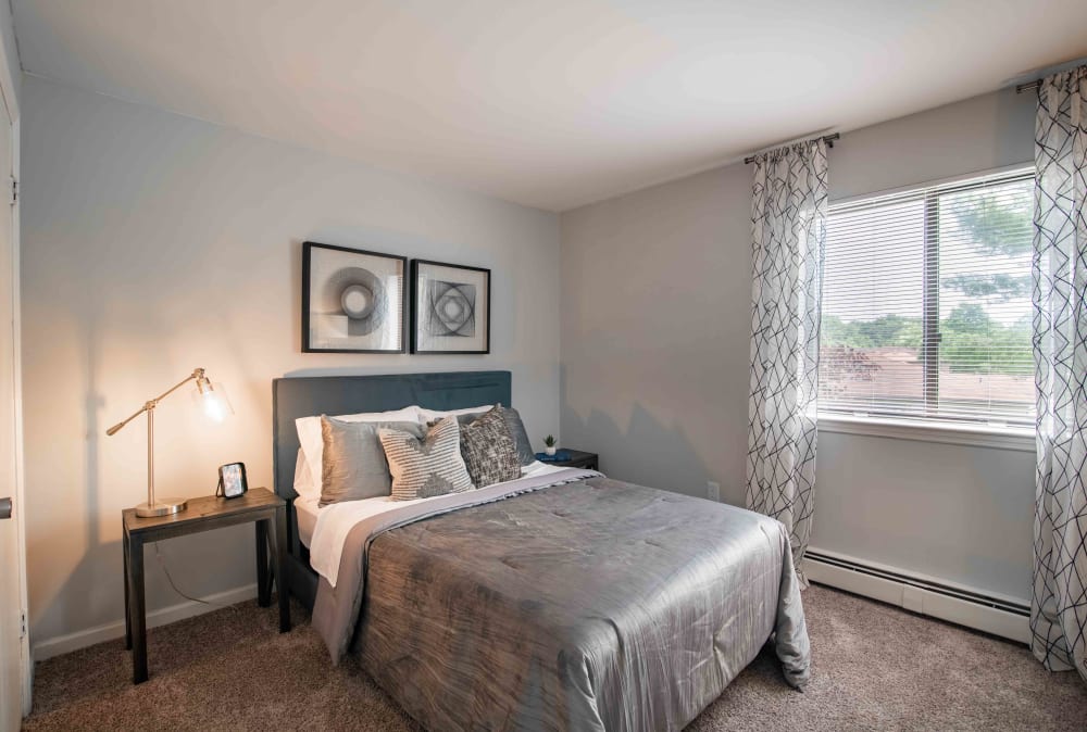 Spacious bedroom with plush carpeting at Imperial Gardens Apartment Homes in Middletown, NY