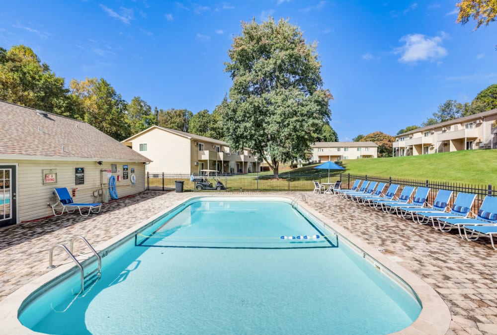 Beautiful blue sky with a luxurious pool Huntersville Apartment Homes in Huntersville, North Carolina