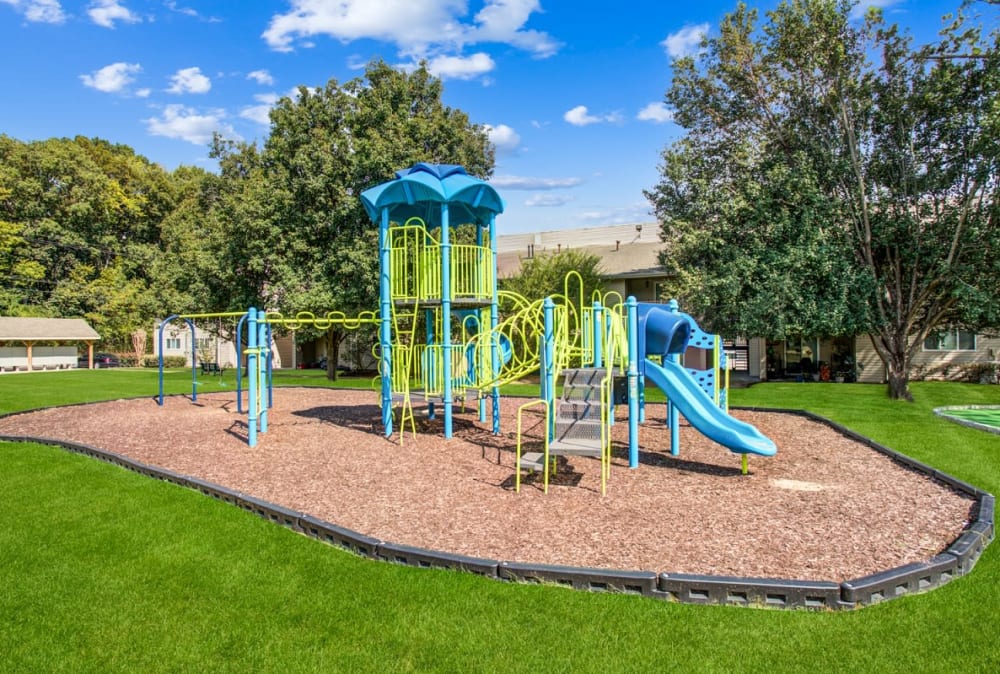 Apartments with a Playground equipped with a slide located at Lincoya Bay Apartments & Townhomes in Nashville, Tennessee