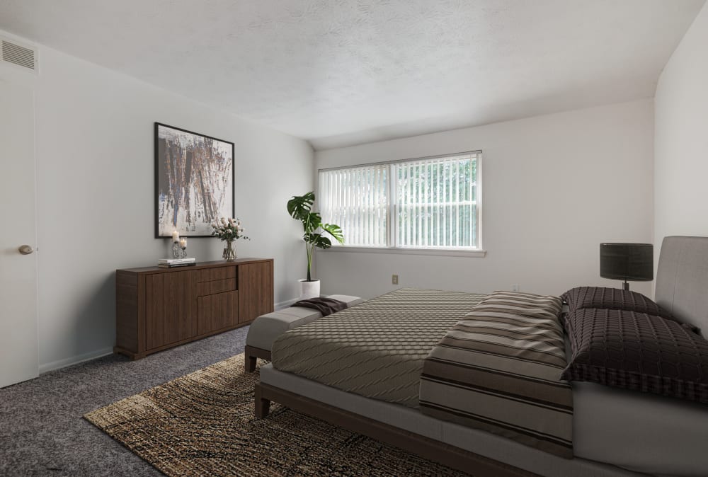 Staged bedroom in a home at Brighton Colony Townhomes in Rochester, New York