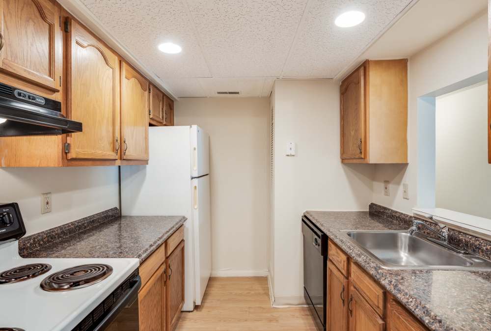 kitchen with wooden cabinets at Vantage Pointe West Apartment Homes in Cincinnati, Ohio