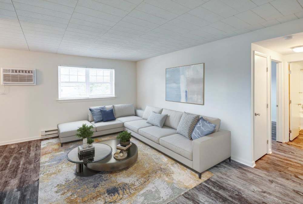 Living room and dining area in an apartment at Quakertown West Apartment Homes in Quakertown, Pennsylvania