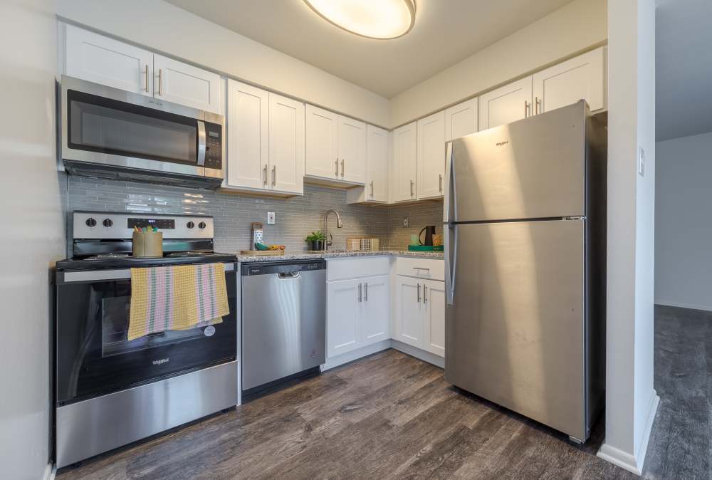 Stunning kitchen with white appliances, microwave and a dishwasher at Ridgeview Apartment Homes in Reading, Pennsylvania