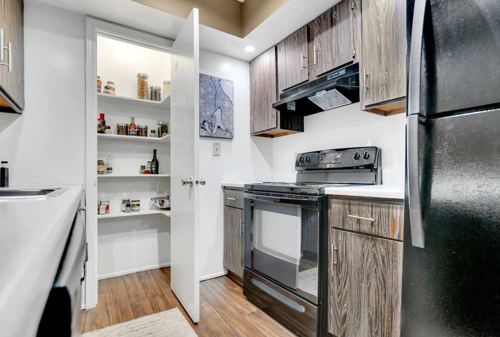 Kitchen with pantry at Canterbury Green in Fort Wayne, Indiana