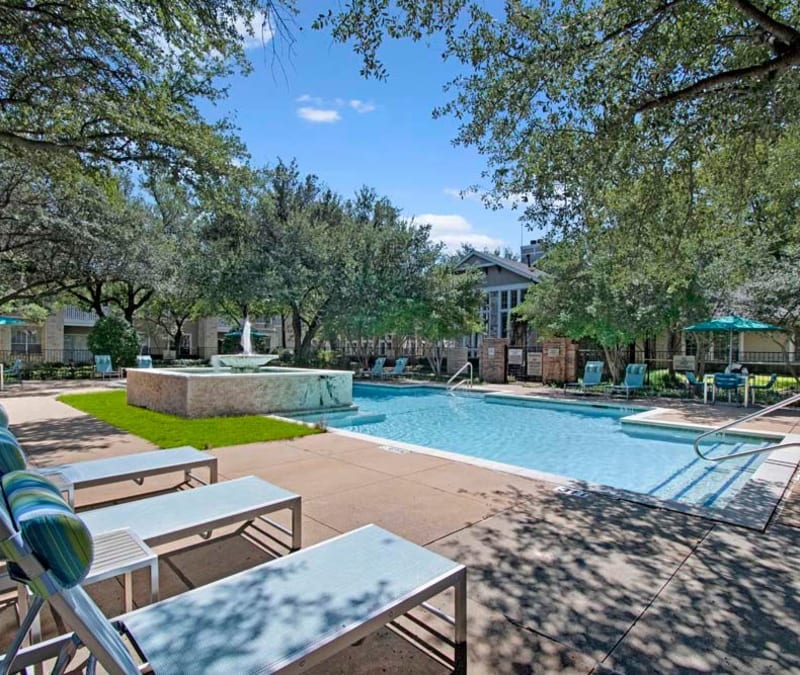 Swimming pool with a fountain at Somerset at Spring Creek in Plano, Texas