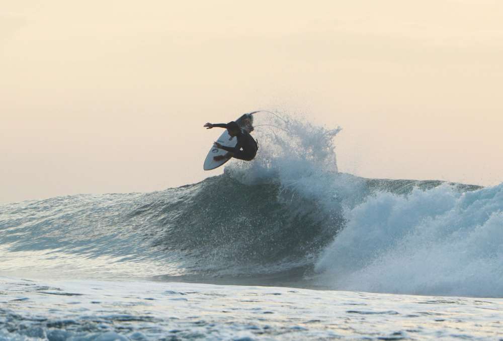 Resident surfing in a beach near RIVA Solana Beach in Solana Beach, California