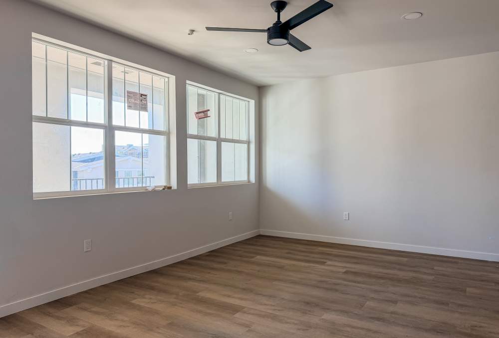 Living space with large windows at RIVA Solana Beach in Solana Beach, California
