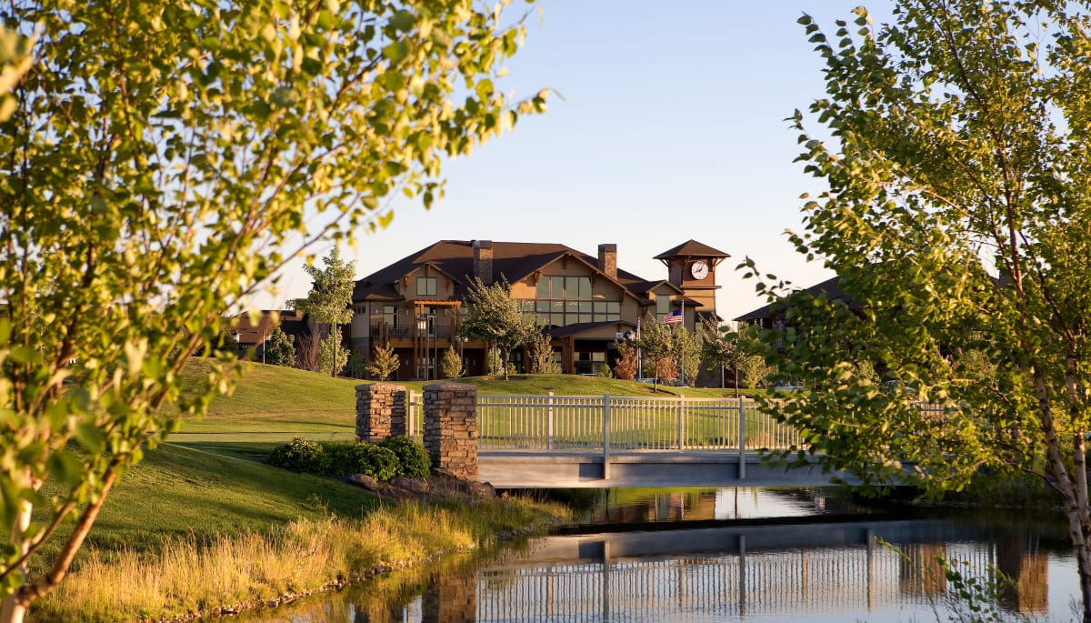 The building exterior and pond at Touchmark at Meadow Lake Village in Meridian, Idaho