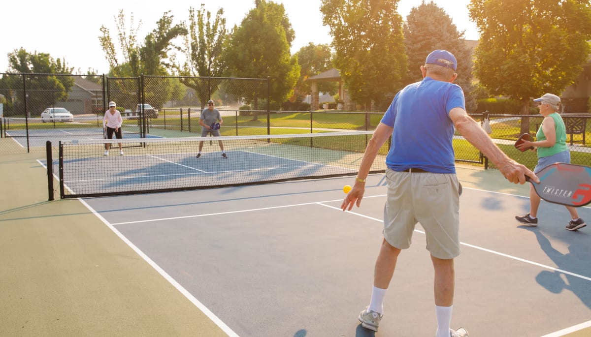 Residence playing pickleball at Touchmark at Meadow Lake Village in Meridian, Idaho