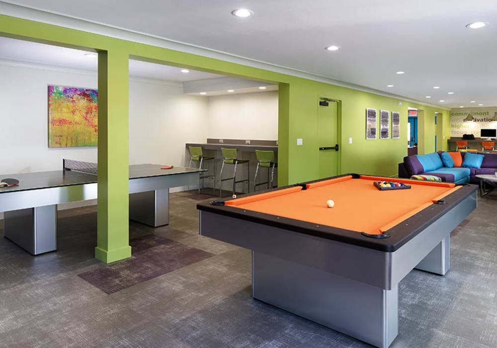 Recreation room inside the clubhouse at UCA Apartment Homes in Fullerton,California