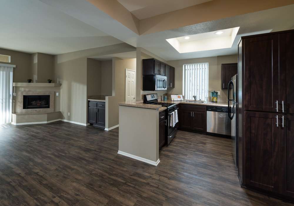 View of the living room and the kitchen at Seapointe Villas in Costa Mesa, California