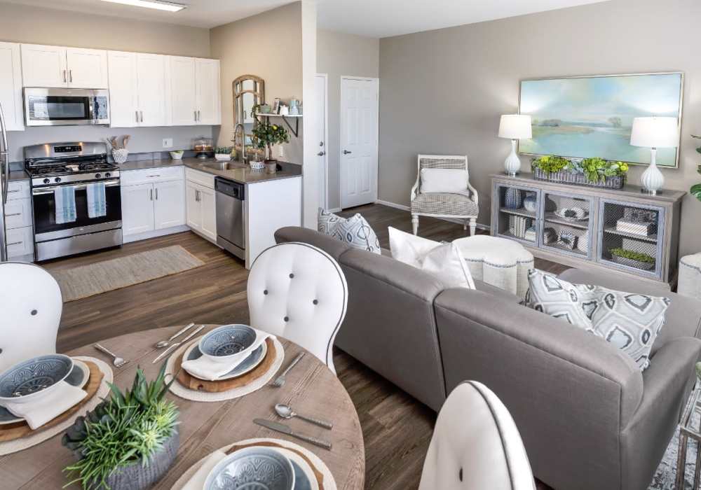 Stylish living room with large sofa and coffee-table at Madrid Apartments in Mission Viejo, California