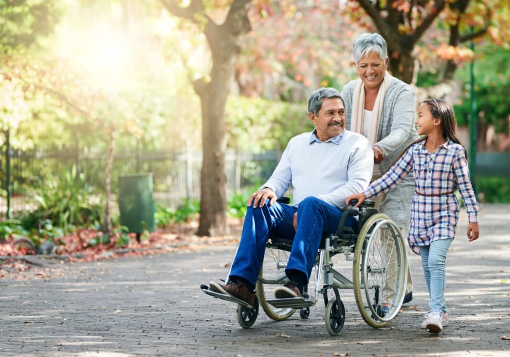 Resident out for a walk with his granddaughter at Ramsey Village Continuing Care in Des Moines, Iowa