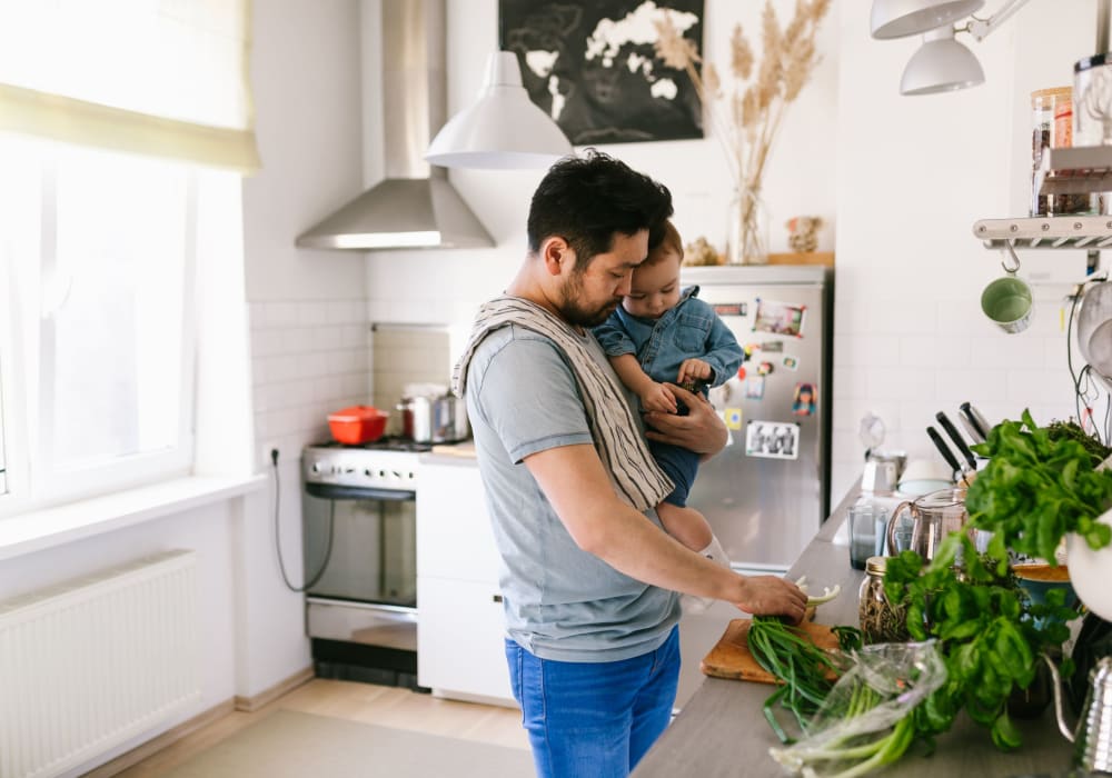 Resident cooking in the kitchen with his kid at Catherine Street in Bloomingdale, New Jersey