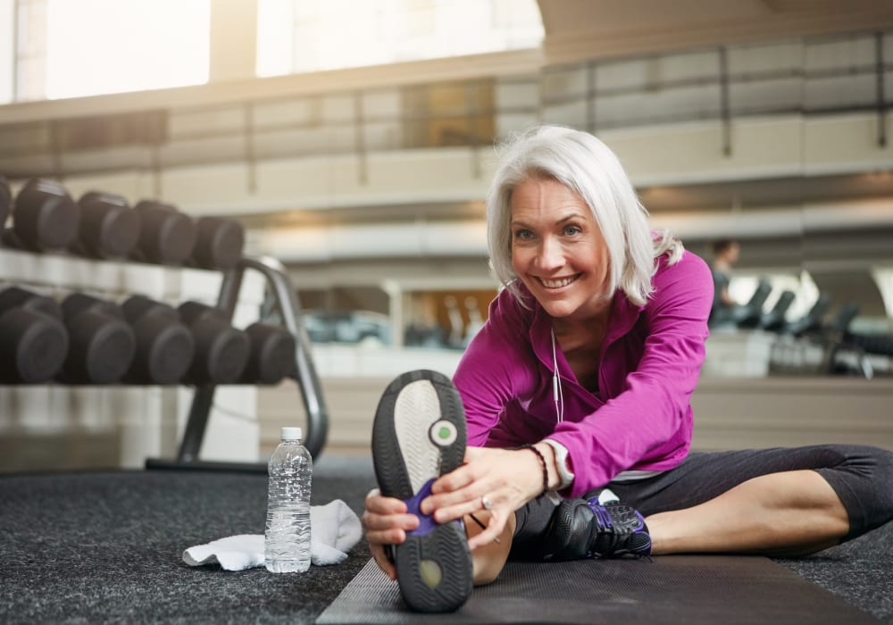 Woman stretching getting ready for a run at Fairview Senior Apartments in Rising Sun, Maryland