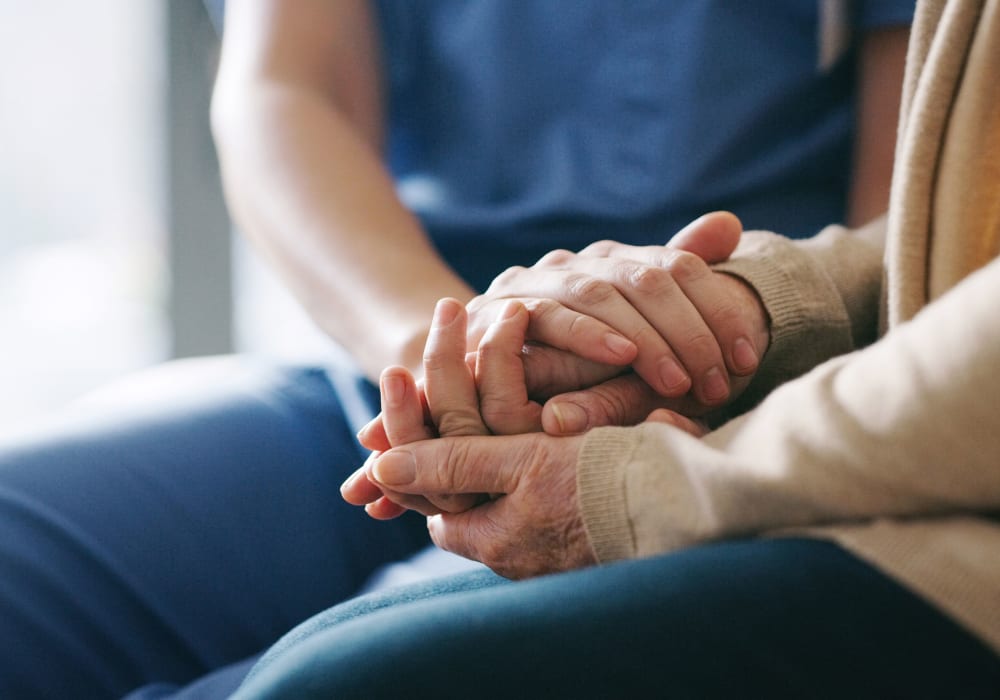 Holding hands at Bridgeport Place Assisted Living in University Place, Washington.