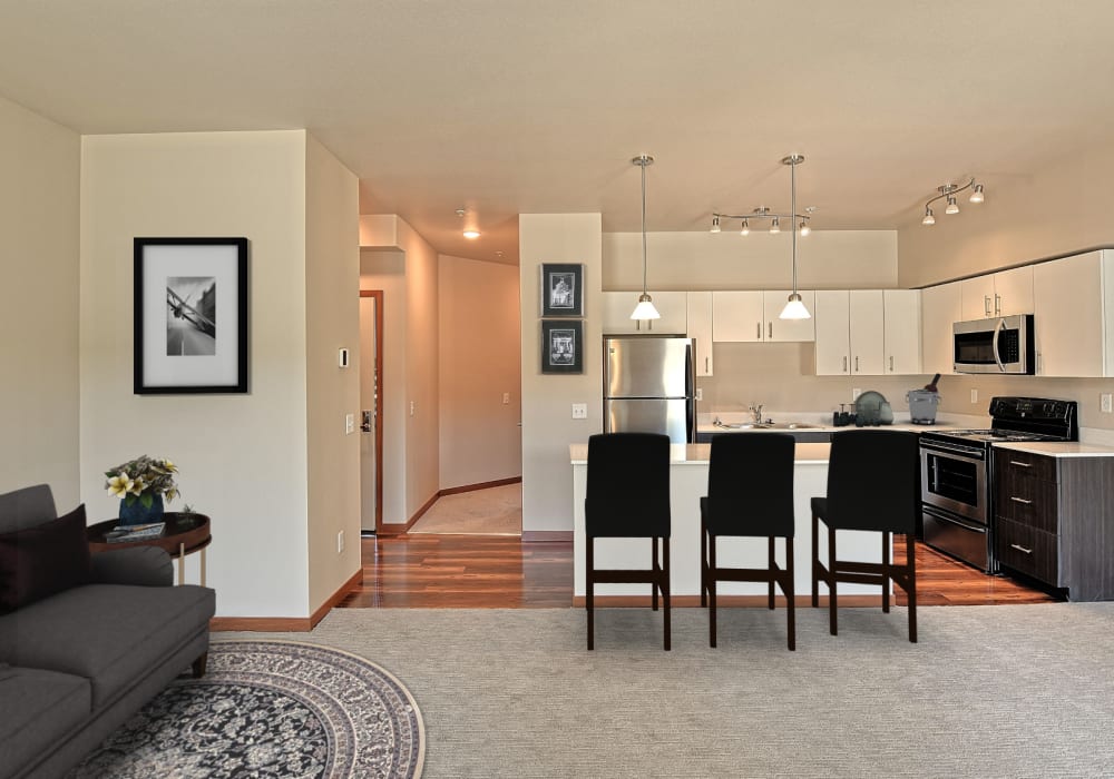 Open floorplan with living room and kitchen area at Courtyard 465 Apartments in Wenatchee, Washington