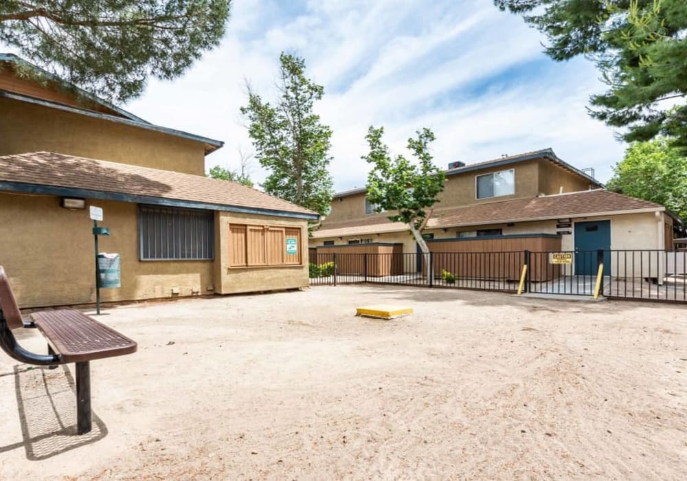 Exterior of complex and dog park at Sienna Heights Apartments apartment homes in Lancaster, California