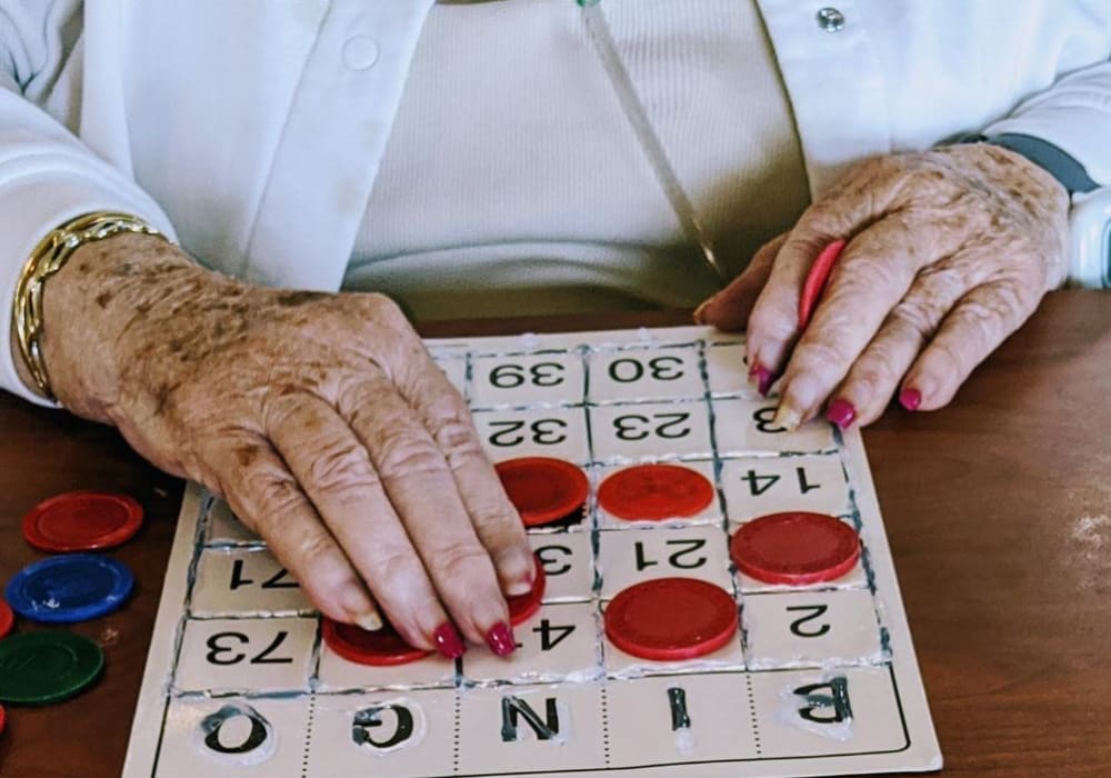 Resident playing bingo at Wellington Place at Hartford in Hartford, Wisconsin