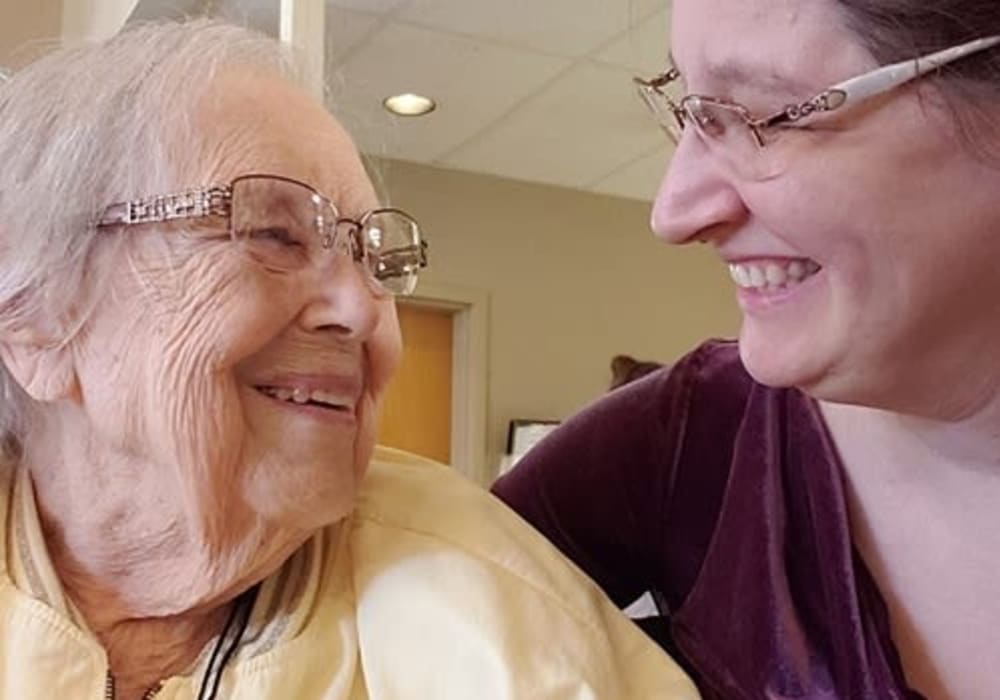 Resident and caregiver smiling at Wellington Place at Whiting in Stevens Point, Wisconsin