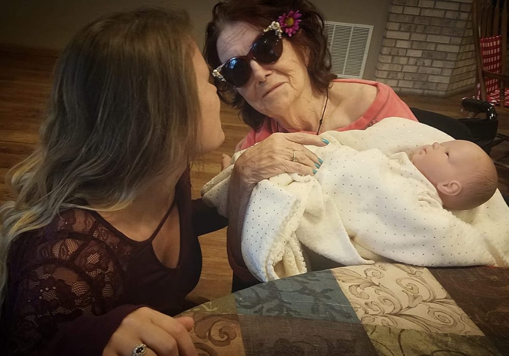 Resident and family during a sweet moment at Wellington Place at Whiting in Stevens Point, Wisconsin